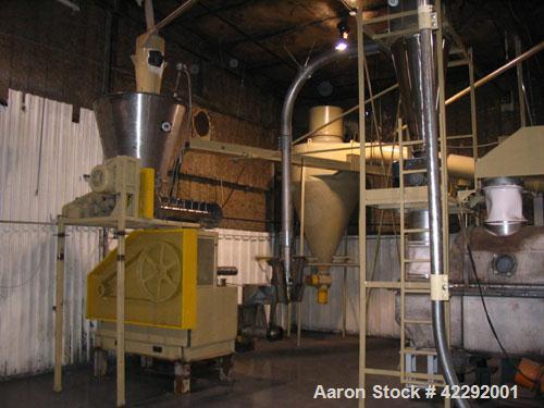 Used Complete Food Grade Extrusion Line, rated 1 ton per hour. Equipment includes: Flexicon hydraulic bulk bag unloader with airlock; single screw 75 hp Conex 5500 extruder; twin screw former that ru...