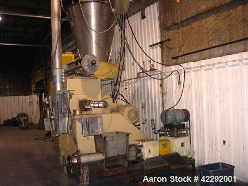 Used Complete Food Grade Extrusion Line, rated 1 ton per hour. Equipment includes: Flexicon hydraulic bulk bag unloader with airlock; single screw 75 hp Conex 5500 extruder; twin screw former that ru...