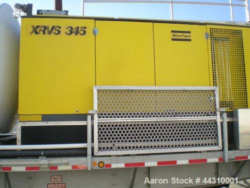 Used CO2 Blasting System.  Includes:  TOMCO2 14 ton storage system, Atlas Copco XRVS 345 air compressor, 100 kv electrical generator, dry ice pelletizer blast cabinet with air filter system, air drye...