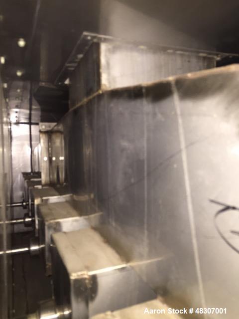 Used Lyons Pilot Coater/Laminator. 15" max coating width, 6" min. 30' oven, 304 SS, two zone, natural gas fired, 18" wide idler rolls. Nip fed three roll reverse roll coating station. Knife over roll...