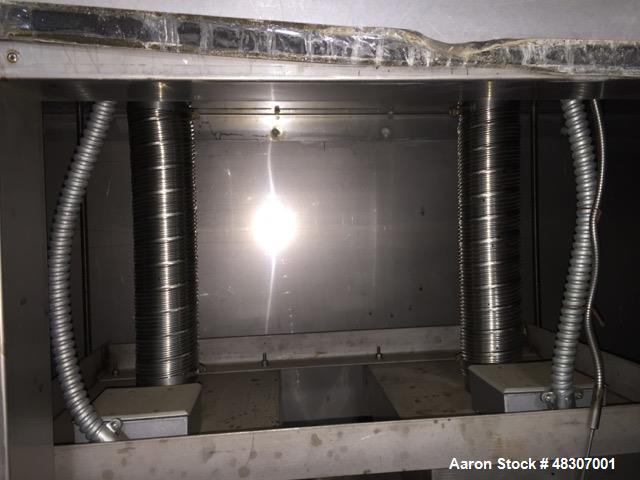 Used Lyons Pilot Coater/Laminator. 15" max coating width, 6" min. 30' oven, 304 SS, two zone, natural gas fired, 18" wide idler rolls. Nip fed three roll reverse roll coating station. Knife over roll...