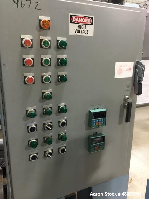 Used Lyons Pilot Coater/Laminator. 15" max coating width, 6" min. 30' oven, 304 SS, two zone, natural gas fired, 18" wide idler rolls. Nip fed three roll reverse roll coating station. Knife over roll...