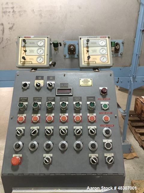 Used Lyons Pilot Coater/Laminator. 15" max coating width, 6" min. 30' oven, 304 SS, two zone, natural gas fired, 18" wide idler rolls. Nip fed three roll reverse roll coating station. Knife over roll...