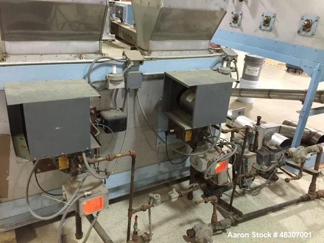 Used Lyons Pilot Coater/Laminator. 15" max coating width, 6" min. 30' oven, 304 SS, two zone, natural gas fired, 18" wide idler rolls. Nip fed three roll reverse roll coating station. Knife over roll...