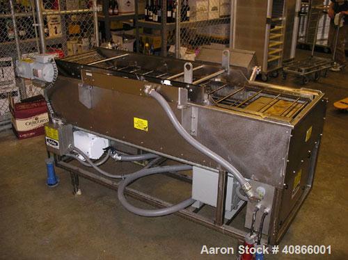 Used Complete Belshaw Century 200 Donut System, 153 dozen donuts per hour. Includes the following equipment:  Century fryer, model C200RH; Multi-Matic cutter with mobile lift carrier, model MDDRF4; C...
