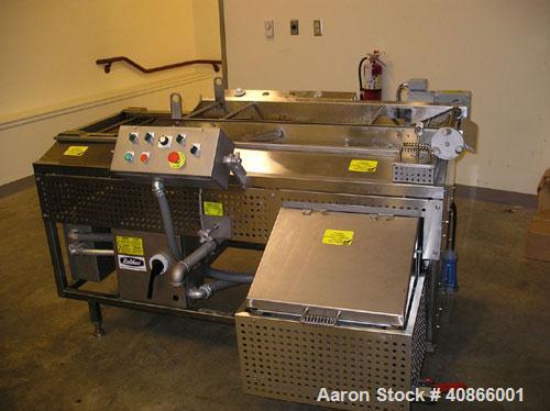 Used Complete Belshaw Century 200 Donut System, 153 dozen donuts per hour. Includes the following equipment:  Century fryer, model C200RH; Multi-Matic cutter with mobile lift carrier, model MDDRF4; C...