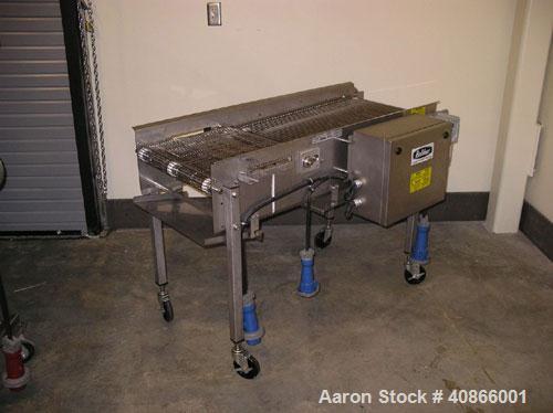 Used Complete Belshaw Century 200 Donut System, 153 dozen donuts per hour. Includes the following equipment:  Century fryer, model C200RH; Multi-Matic cutter with mobile lift carrier, model MDDRF4; C...
