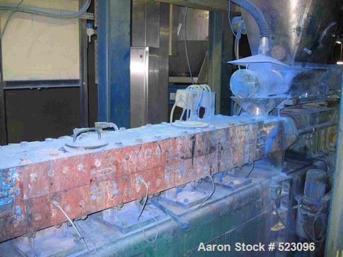 USED: Comac extrusion line. (1) Feeding system Matcon or Anag containers, servo lift Matcon (hydraulic lifting and positioning system), with 55 gallon (210 liter) Matcon buffer, screw feeder. (1) Com...