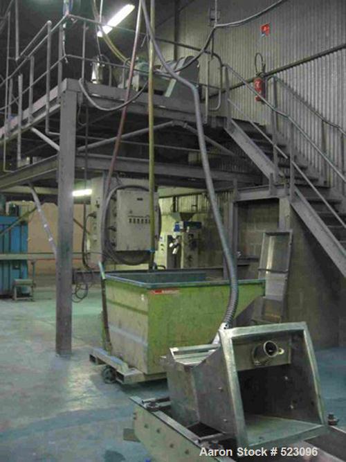 USED: Comac extrusion line. (1) Feeding system Matcon or Anag containers, servo lift Matcon (hydraulic lifting and positioning system), with 55 gallon (210 liter) Matcon buffer, screw feeder. (1) Com...