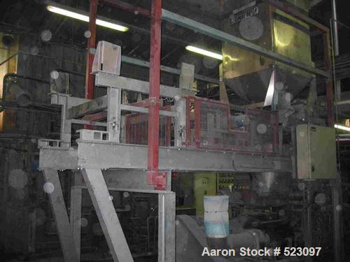 USED: Comac extrusion line. (1) Feeding system Matcon or Anag containers, servo lift Matcon (hydraulic lifting and positioning system), with 55 gallon (210 liter) Matcon buffer, screw feeder. (1) Com...