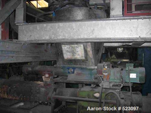 USED: Comac extrusion line. (1) Feeding system Matcon or Anag containers, servo lift Matcon (hydraulic lifting and positioning system), with 55 gallon (210 liter) Matcon buffer, screw feeder. (1) Com...