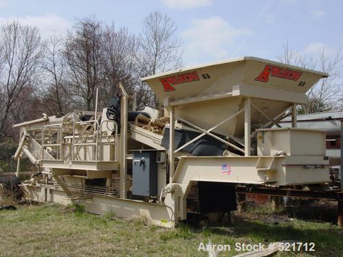 USED: Kohlberg/Portec portable pugmill, model 53, Built 1996. 100 tons/hour, 48" x 5' extended to 15', 36" wide conveyor.