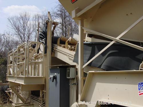 USED: Kohlberg/Portec portable pugmill, model 53, Built 1996. 100 tons/hour, 48" x 5' extended to 15', 36" wide conveyor.