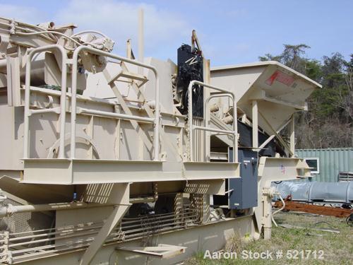 USED: Kohlberg/Portec portable pugmill, model 53, Built 1996. 100 tons/hour, 48" x 5' extended to 15', 36" wide conveyor.