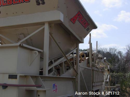 USED: Kohlberg/Portec portable pugmill, model 53, Built 1996. 100 tons/hour, 48" x 5' extended to 15', 36" wide conveyor.