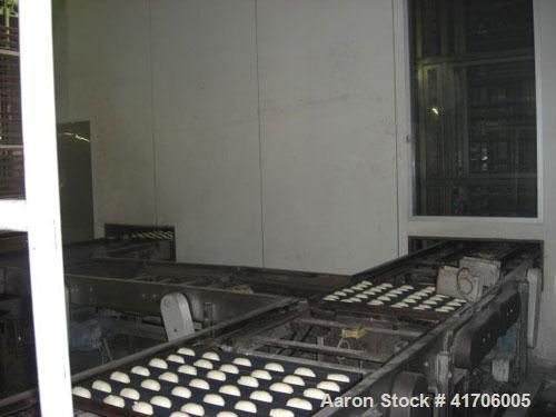 Used Mecatherm Baguette Line, output capacity 24,000 baguettes.Comprised of: (2) Mecatherm 2500 baguette lines dough divider, master roll, partial device for rolls, metal sheets transportation.(1) Cu...