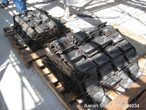 Used Vegetable Grading System, reportedly last used on tomatoes. Consists of 32 in wide grading belts, one 20 ft long, one 16 ft long, each with 3 side discharge belts. Also includes Cap Way inclined...