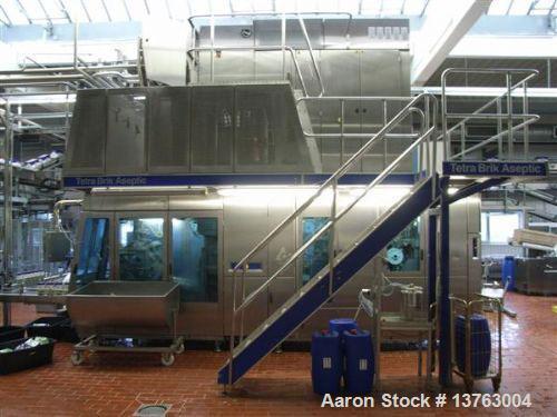 Used Tetra Pak TBA 21 Slim with PT21 Pull-Tab System, aseptic carton filler. Capacity 7,000 units per hour, unit volume 33.8 oz (1 liter). Manuals included. Work hours 29,482.