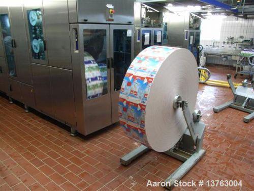 Used Tetra Pak TBA 21 Slim with PT21 Pull-Tab System, aseptic carton filler. Capacity 7,000 units per hour, unit volume 33.8 oz (1 liter). Manuals included. Work hours 29,482.
