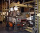 Used Complete Food Grade Extrusion Line, rated 1 ton per hour. Equipment includes: Flexicon hydraulic bulk bag unloader with airlock; single screw 75 hp Conex 5500 extruder; twin screw former that ru...