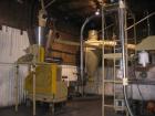 Used Complete Food Grade Extrusion Line, rated 1 ton per hour. Equipment includes: Flexicon hydraulic bulk bag unloader with airlock; single screw 75 hp Conex 5500 extruder; twin screw former that ru...