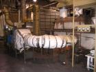 Used Complete Food Grade Extrusion Line, rated 1 ton per hour. Equipment includes: Flexicon hydraulic bulk bag unloader with airlock; single screw 75 hp Conex 5500 extruder; twin screw former that ru...