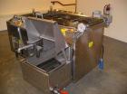 Used Complete Belshaw Century 200 Donut System, 153 dozen donuts per hour. Includes the following equipment:  Century fryer, model C200RH; Multi-Matic cutter with mobile lift carrier, model MDDRF4; C...