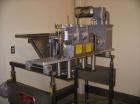 Used Complete Belshaw Century 200 Donut System, 153 dozen donuts per hour. Includes the following equipment:  Century fryer, model C200RH; Multi-Matic cutter with mobile lift carrier, model MDDRF4; C...