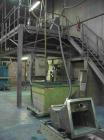 USED: Comac extrusion line. (1) Feeding system Matcon or Anag containers, servo lift Matcon (hydraulic lifting and positioning system), with 55 gallon (210 liter) Matcon buffer, screw feeder. (1) Com...
