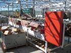 Used Vegetable Grading System, reportedly last used on tomatoes. Consists of 32 in wide grading belts, one 20 ft long, one 16 ft long, each with 3 side discharge belts. Also includes Cap Way inclined...