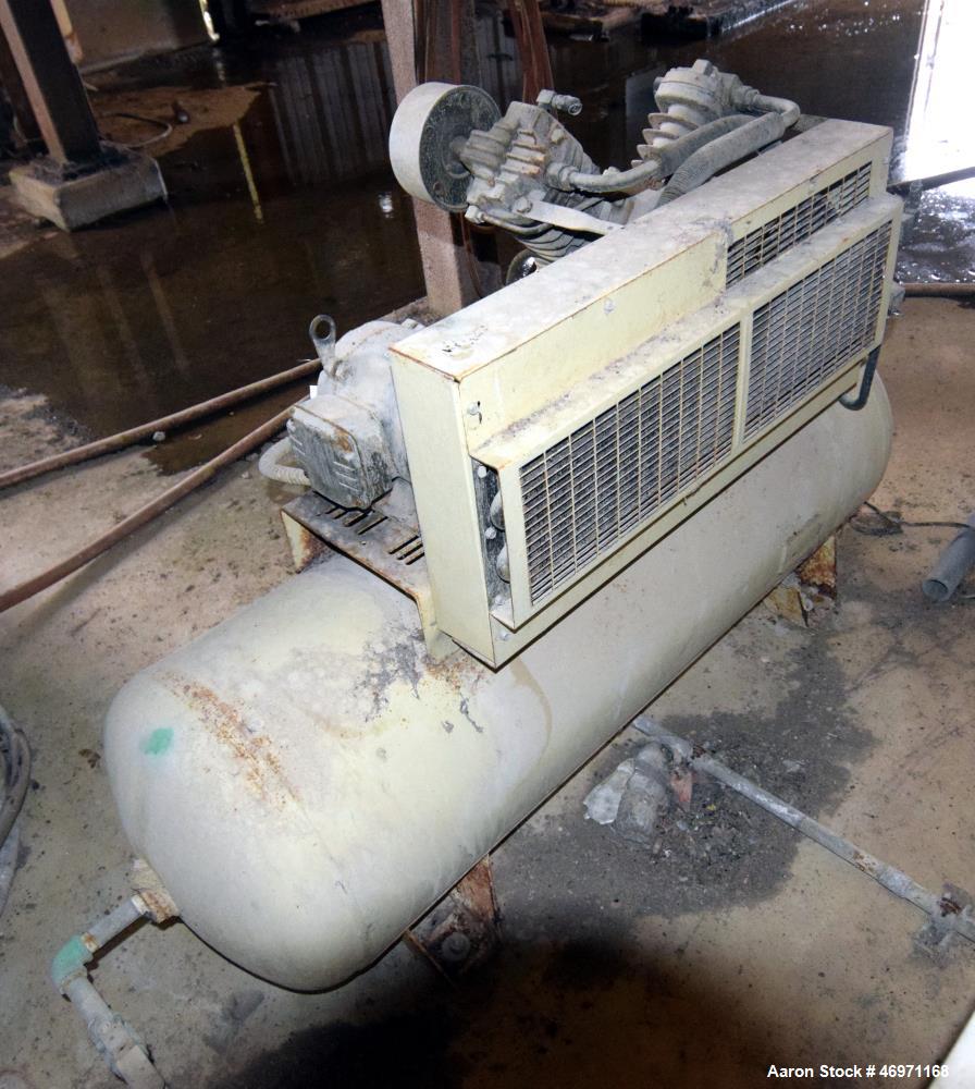 Used Ingersoll Rand Reciprocating Air Compressor, Model 2475D5. Rated 17.1 cfm at 90 psi. Driven by a 5hp, 3/60/200 volt, 1740 rpm motor. Mounted on an approximate 80 gallon horizontal tank. Serial# ...