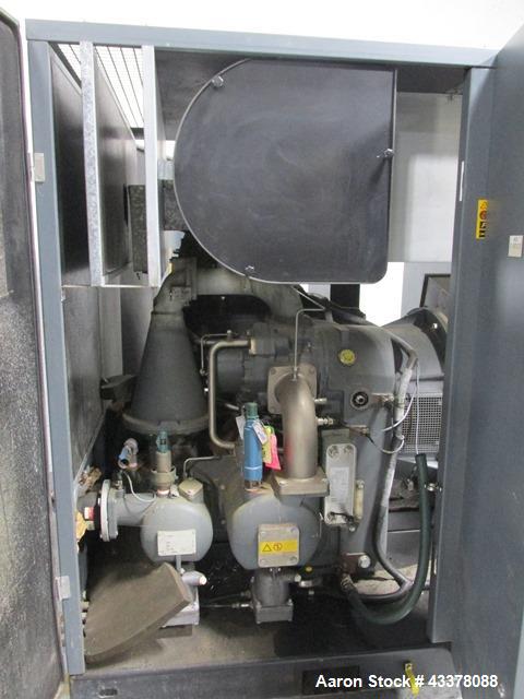 Used Atlas Copco Water Cooled Oil Free Rotary Screw Compressor, Model ZR250. Rated 1100 CFM, 125 psi. Driven by a 300hp, 460 volt motor. Includes an Atlas Copco MD600 air dryer, serial# AID011985, an...