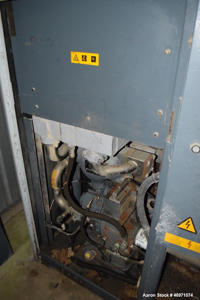 Used Atlas Copco Oil Free Rotary Screw Compressor, Model ZT 22. Air cooled, 117.2 CFM at 124 psi. Driven by a 30hp motor. Includes an Elektronikon controller. Serial# AII705773, built 2006.