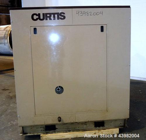 Used Curtis RS Series Rotary Screw Compressor, Model R/S-150D-A/E-E75G. Air cooled, rated 706 cfm at 125 psi. Driven by a 150 hp, 3/60/460 volt, 1780 rpm motor.  Includes a control panel and sound en...