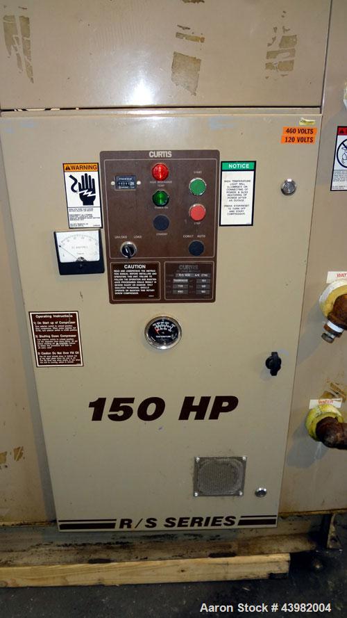Used Curtis RS Series Rotary Screw Compressor, Model R/S-150D-A/E-E75G. Air cooled, rated 706 cfm at 125 psi. Driven by a 150 hp, 3/60/460 volt, 1780 rpm motor.  Includes a control panel and sound en...