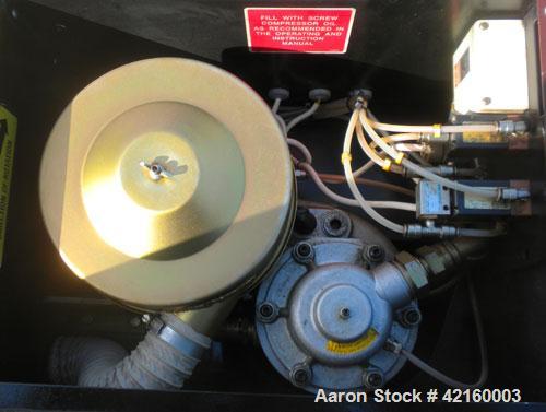 Used Curtis-Toledo Single Stage Rotary Screw Compressor, Model RS10. Oil cooled, 38.5 CFM at 115 psi at 4940 rpm. Driven by a 10 hp motor.Includes a control panel, and sound enclosure. Requires air t...