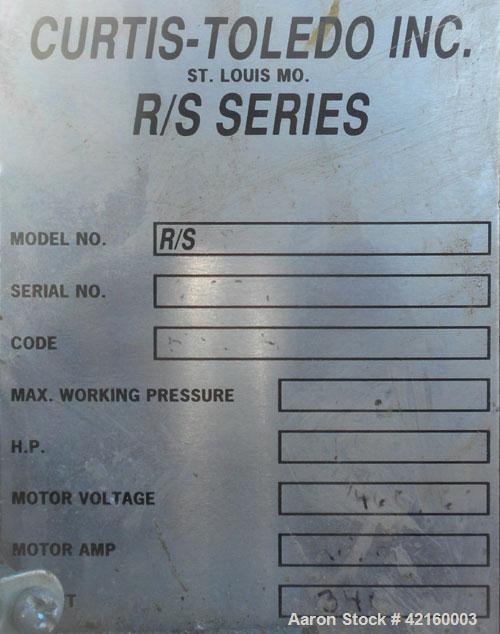 Used Curtis-Toledo Single Stage Rotary Screw Compressor, Model RS10. Oil cooled, 38.5 CFM at 115 psi at 4940 rpm. Driven by a 10 hp motor.Includes a control panel, and sound enclosure. Requires air t...