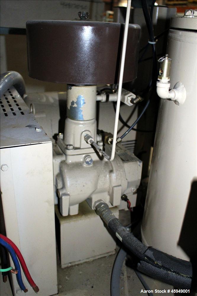 Used Curtis Rotary Screw Air Compressor, 120 Gallon, Model RS25A A-E B101. Rated 104 CFM at 125 psi. Driven by a 25hp,  3/60/200 volt, 1760 rpm motor. Curtis-Toledo compressor model B101-V001. Has mu...