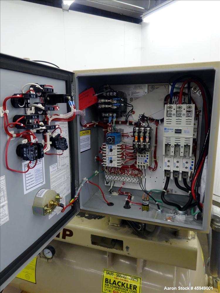 Used Curtis Rotary Screw Air Compressor, 120 Gallon, Model RS25A A-E B101. Rated 104 CFM at 125 psi. Driven by a 25hp,  3/60/200 volt, 1760 rpm motor. Curtis-Toledo compressor model B101-V001. Has mu...