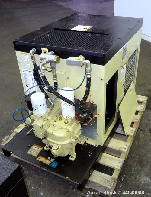Used Ingersoll-Rand Unigy Rotary Screw Air Compressor, Model UNI-15-150-H. Capacity 53 CFM, rated operating pressure 125psi. Driven by a 12.5kw (15hp), 400 volt motor. Includes a sound enclosure. Bui...