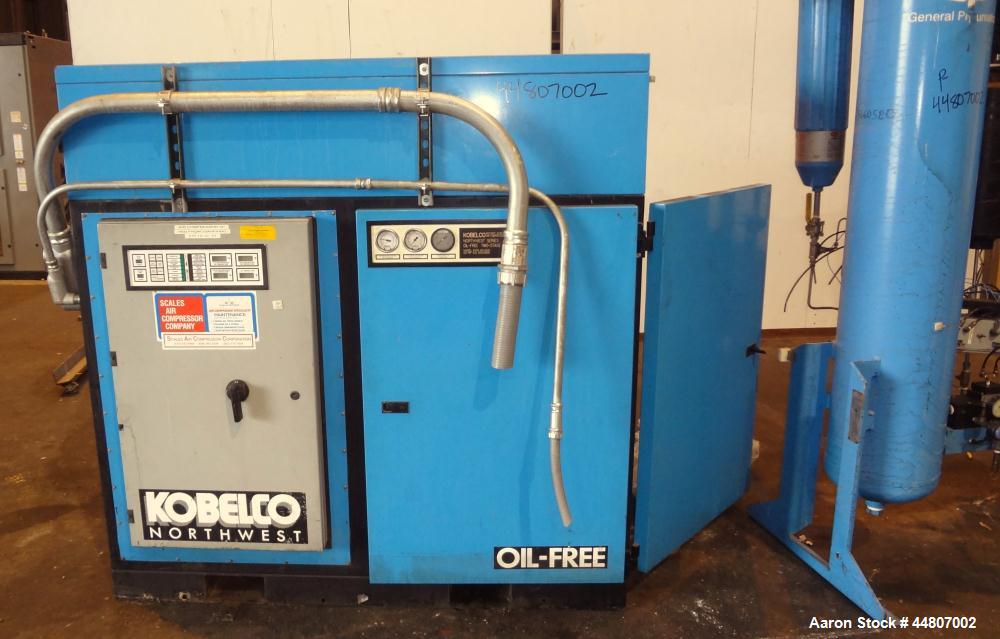 Used Kobelco KNW Series Two Stage Oil Free Rotary Screw Compressor, Model KNW A0-B/H. Air cooled. Rated approximately 223 cfm at 150 psig. Driven by a 60 hp motor. Enclosed in a sound dampening cabin...