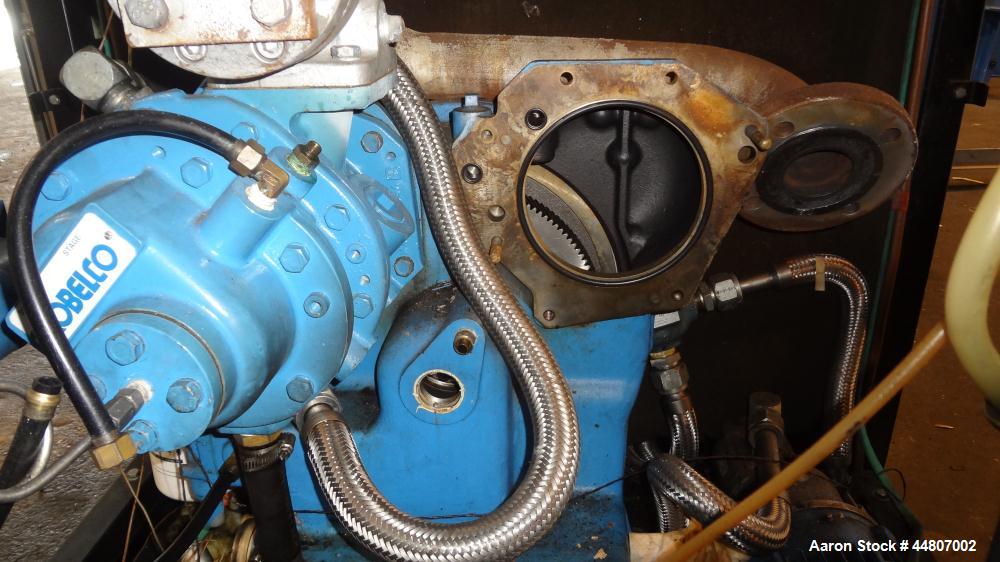 Used Kobelco KNW Series Two Stage Oil Free Rotary Screw Compressor, Model KNW A0-B/H. Air cooled. Rated approximately 223 cfm at 150 psig. Driven by a 60 hp motor. Enclosed in a sound dampening cabin...