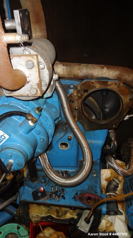 Used Kobelco KNW Series Two Stage Oil Free Rotary Screw Compressor, Model KNW A0-B/H. Air cooled. Rated approximately 223 cfm at 150 psig. Driven by a 60 hp motor. Enclosed in a sound dampening cabin...