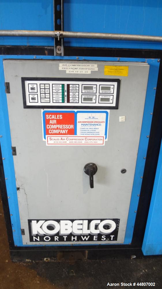 Used Kobelco KNW Series Two Stage Oil Free Rotary Screw Compressor, Model KNW A0-B/H. Air cooled. Rated approximately 223 cfm at 150 psig. Driven by a 60 hp motor. Enclosed in a sound dampening cabin...