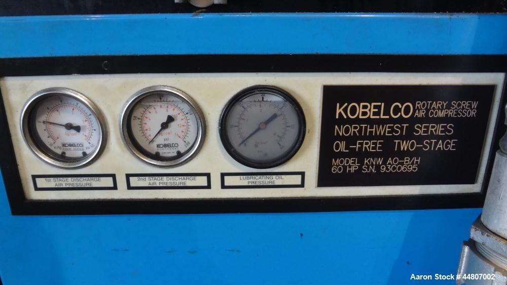 Used Kobelco KNW Series Two Stage Oil Free Rotary Screw Compressor, Model KNW A0-B/H. Air cooled. Rated approximately 223 cfm at 150 psig. Driven by a 60 hp motor. Enclosed in a sound dampening cabin...