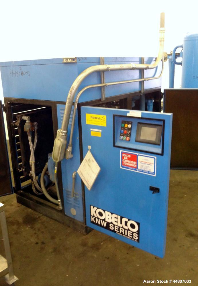 Used Kobelco KNW Series Two Stage Oil Free Rotary Screw Compressor, Model KNW A0-B/H. Air cooled. Rated approximately 223 cfm at 150 psig. Driven by a 60 hp motor. Enclosed in a sound dampening cabin...