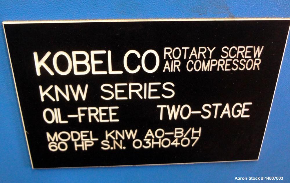 Used Kobelco KNW Series Two Stage Oil Free Rotary Screw Compressor, Model KNW A0-B/H. Air cooled. Rated approximately 223 cfm at 150 psig. Driven by a 60 hp motor. Enclosed in a sound dampening cabin...