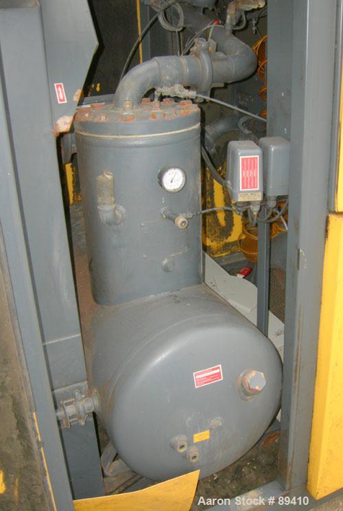 USED: Kaeser stationary rotary screw compressor, model DS140, aircooled. Capacity approximately 520 cfm at 110 psi. Driven by a 100 hp,3/60/460 volt motor. Unit includes a control panel. Skid mounted...