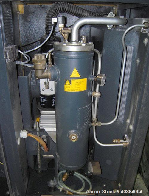 Used Kaeser Stationary Rotary Screw Compressor, Model SK 24, Air Cooled. Capacity approximately 50 cfm at 188 psi. Driven by a 20 hp, 3/60/230/460 volt, 1740 rpm motor. Unit includes a control panel....