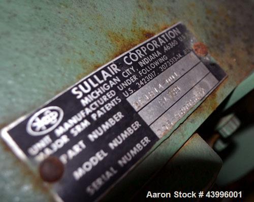 Used Sullair Air Cooled Rotary Screw Air Compressor, Model 25-200H ACAC. Approximately 900 cfm at 150 psig. Driven by a 250hp, 3/60/460 volt, 1770 rpm motor. Includes a control panel, and sound enclo...